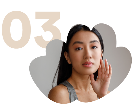 asian-young-woman-with-perfect-skin-standing-studio
