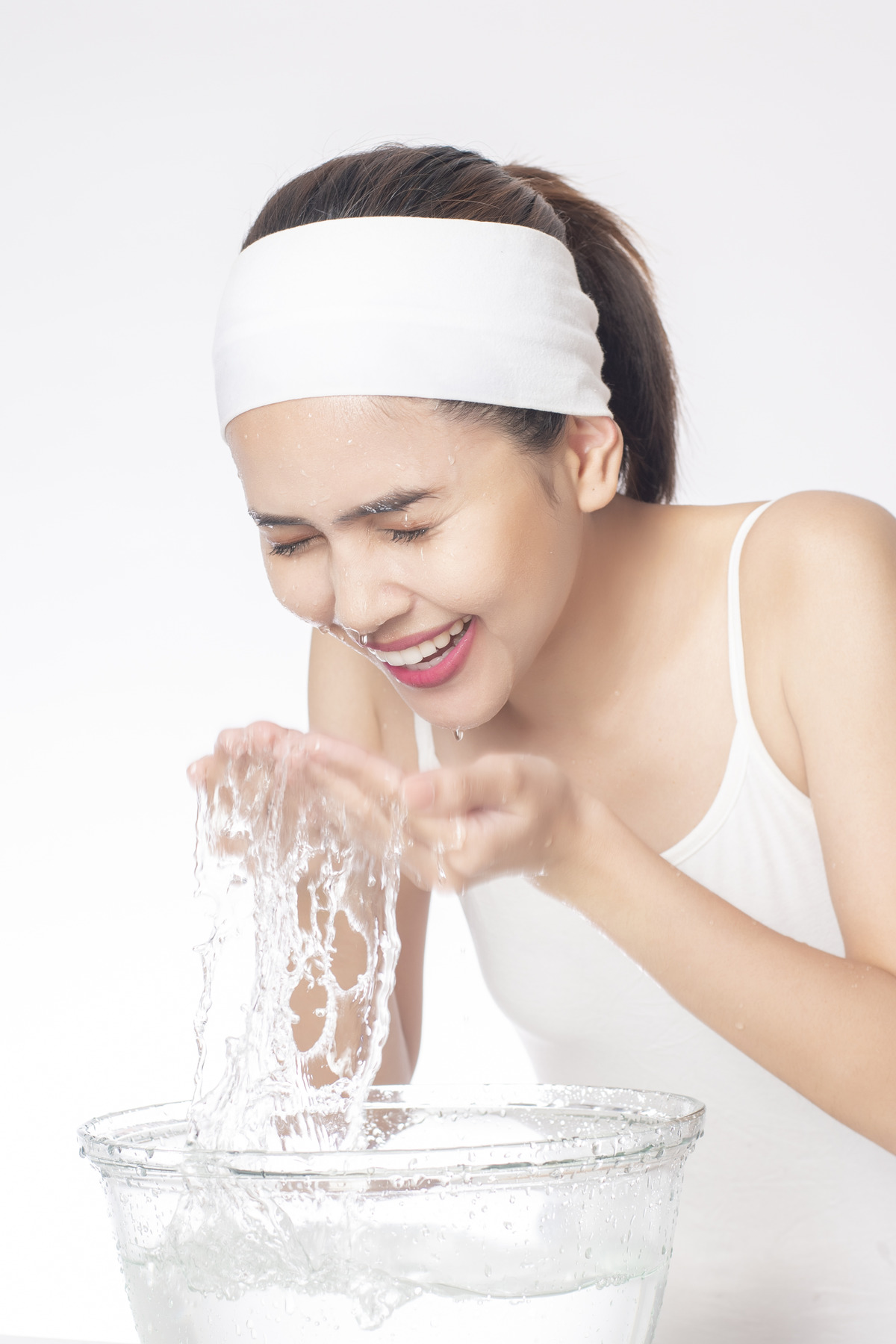 beautiful-woman-is-washing-her-face-white-background